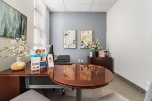 Consultation room at Parie Med Spa with modern decor and informational brochures