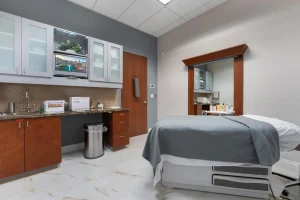 Modern treatment room with equipment for facial treatments at Parie Med Spa