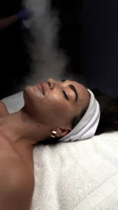 Client receiving Hydrafacial treatment with steam at Parie Med Spa